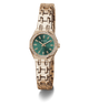 GUESS Ladies Rose Gold Tone Analog Watch with a green face on a white background