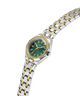 Two-tone watch with a green face on a white background lifestyle