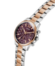 GUESS Ladies 2-Tone Multi-function Watch with a cherry face on a white background lifestyle