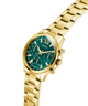 Gold GUESS Ladies Gold Tone Multi-function Watch with a green face on a white background lifestyle