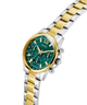Two-tone gold and silver GUESS Ladies 2-Tone Multi-function Watch with a green dial on a white background lifestyle