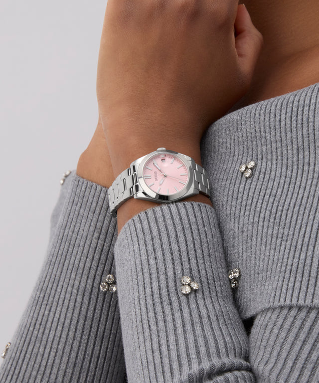 GUESS Ladies Silver Tone Date Watch on a wrist with a gray sweater background