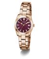 GUESS Ladies Rose Gold Tone Date Watch with a deep red face on a white background