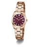 GUESS Ladies Rose Gold Tone Date Watch with a deep red face on a white background