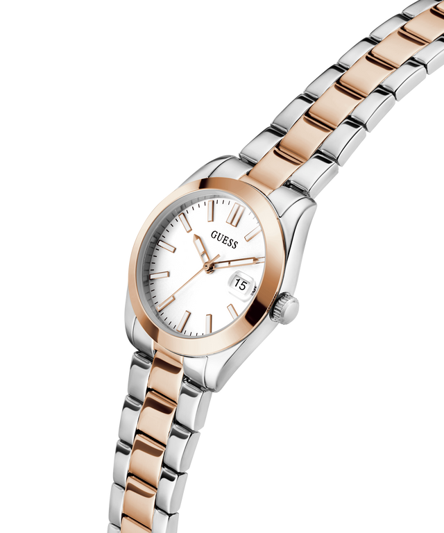 Two-tone silver and rose gold GUESS Ladies 2-Tone Date Watch with white face on a white background lifestyle