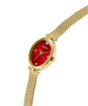 GUESS Ladies Gold Tone Analog Watch with a red face on a white background lifestyle