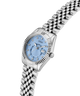 Silver watch with a blue face on a white background lifestyle
