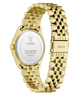 Gold-tone stainless steel watch with a metal link bracelet and a white circular case back, shown on a clean white background. The GUESS brand name is visible on the clasp and case back.