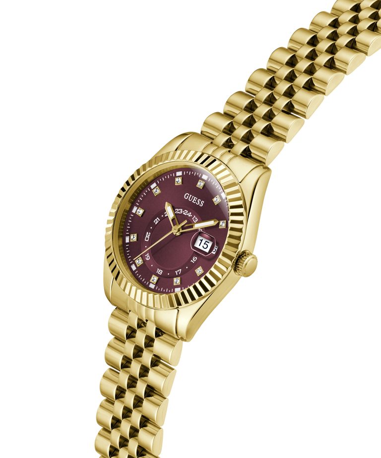 Gold-tone wristwatch with a fluted bezel, gold link bracelet, and a maroon dial featuring diamond hour markers and a date window. lifestyle