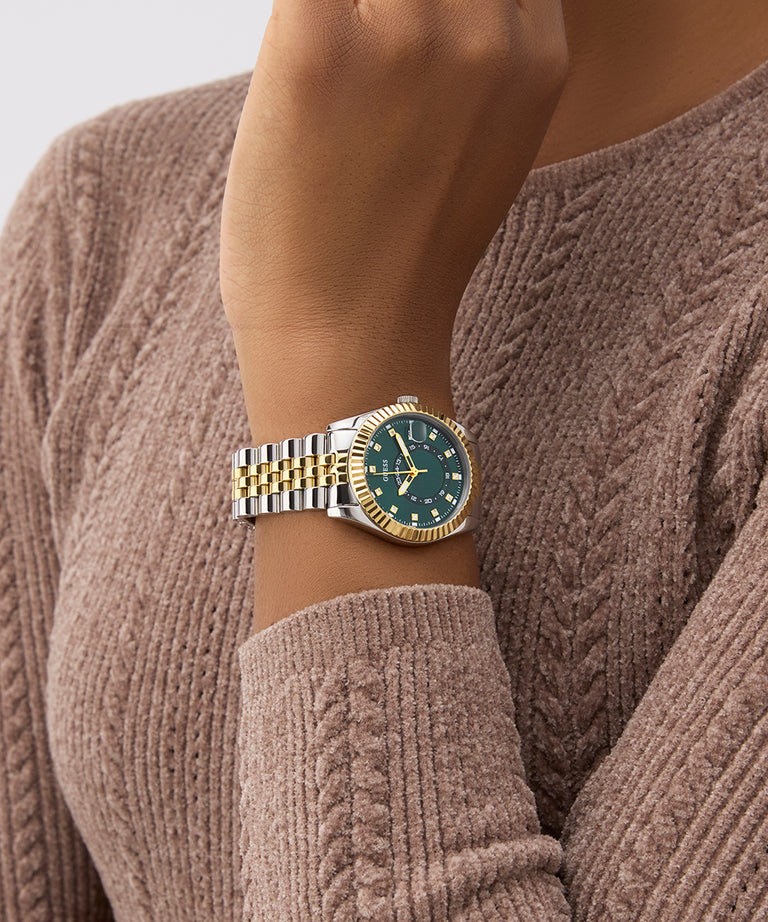 Gold and silver watch on a wrist with a brown sweater GW0936L3
