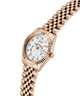 Rose gold watch with a white face on a white background lifestyle