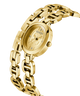 Gold watch with chain strap on a white background lifestyle