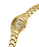 GUESS Ladies Gold Tone Analog Watch with a detailed face and diamond-studded band on a white background lifestyle