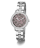 Silver watch with pink face and diamond-like accents on a white GUESS Ladies Silver Tone Analog Watch background