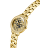 Gold watch with a decorative face on a white background lifestyle