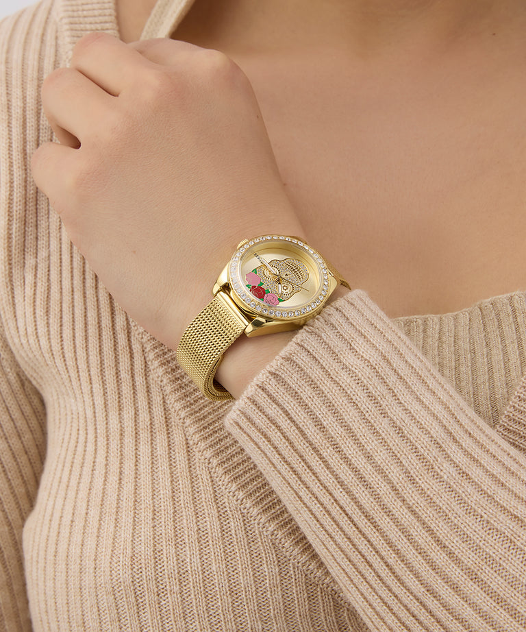 Limited Edition Day Of The Dead watch with a decorative face on a person wearing a beige sweater.