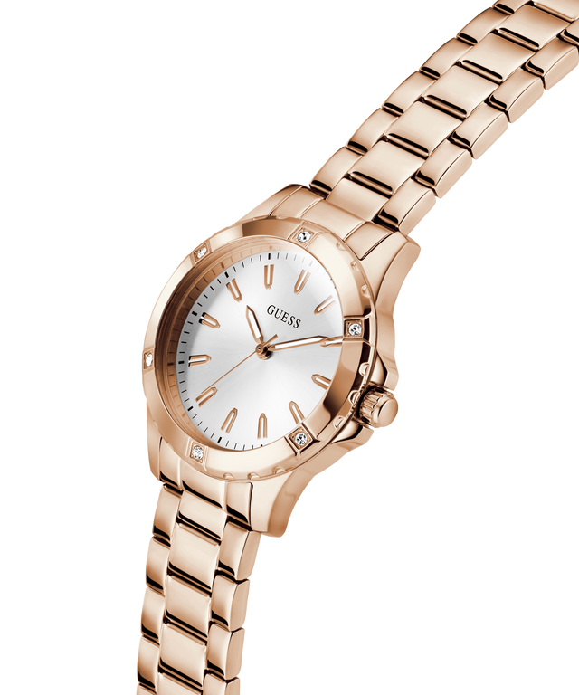 Gold watch with a white face on a white background lifestyle