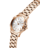 Gold watch with a white face on a white background lifestyle