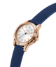 Watch with rose gold case and blue strap on a white background lifestyle