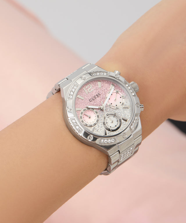 Silver watch GW0950L1 with a pink face on a wrist against a light background