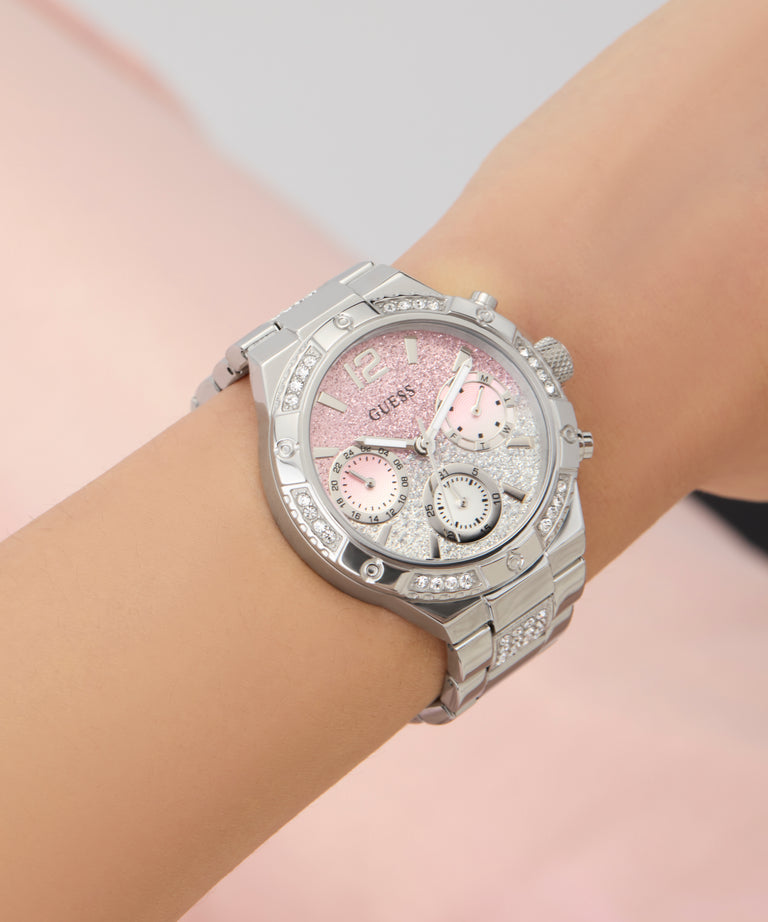 Silver watch GW0950L1 with a pink face on a wrist against a light background