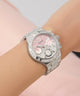 Silver watch GW0950L1 with a pink face on a wrist against a light background