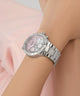 Silver watch GW0950L1 with a pink face on a wrist against a light background