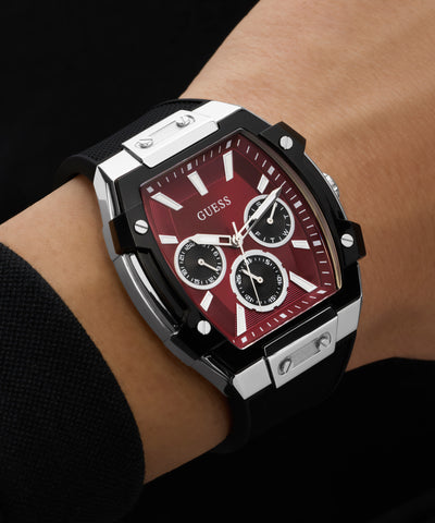 Guess watch on a wrist with a red face and black accents