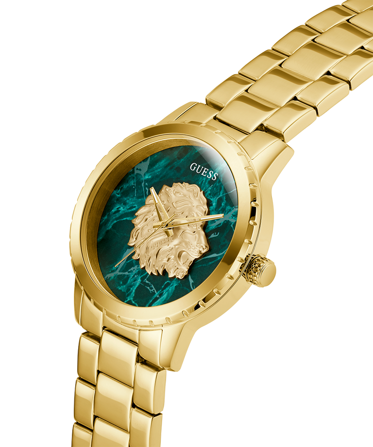GUESS Mens Gold Tone Analog Watch with a green face and lion emblem on a white background lifestyle