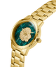 GUESS Mens Gold Tone Analog Watch with a green face and lion emblem on a white background lifestyle