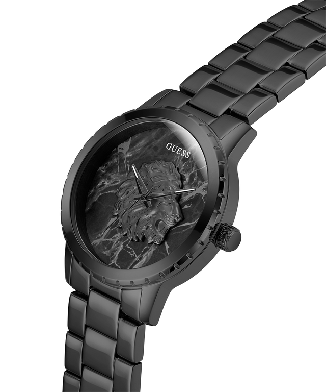 Black watch with marble-like face and Guess branding on a white background lifestyle