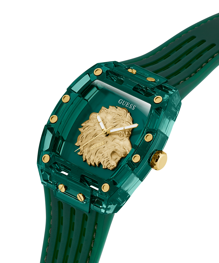 Green watch with gold lion emblem and 'Guess' branding on a white background lifestyle