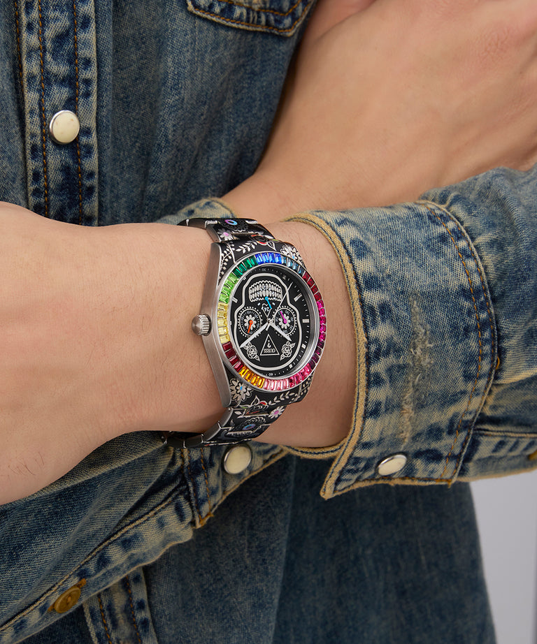 Wrist wearing a colorful Limited Edition Day Of The Dead watch with a denim jacket