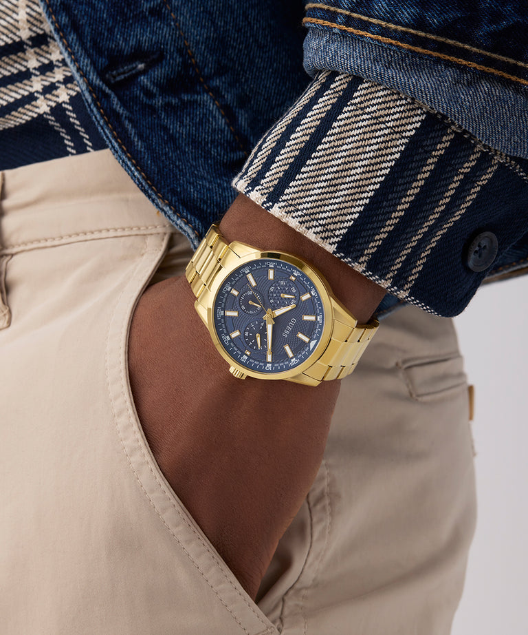 Gold watch on a wrist with a plaid shirt and denim jacket GW0963G2
