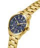 Gold watch with a blue face on a white background lifestyle