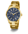 Gold watch with a blue face on a white background GUESS Mens Gold Tone Multi-function Watch