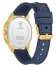 Guess watch with blue strap and gold caseback on a white background
