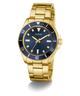GUESS Mens Gold Tone Analog Watch with a blue dial on a white background