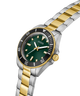 Two-tone silver and gold watch with a green dial on a white background lifestyle