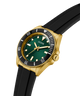 GUESS Mens Black Gold Tone Analog Watch with green dial, gold case, and black strap on a white background lifestyle