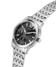 Silver watch with black dial on a white background lifestyle