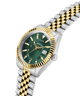 Two-tone watch with green dial and gold accents on a white background lifestyle