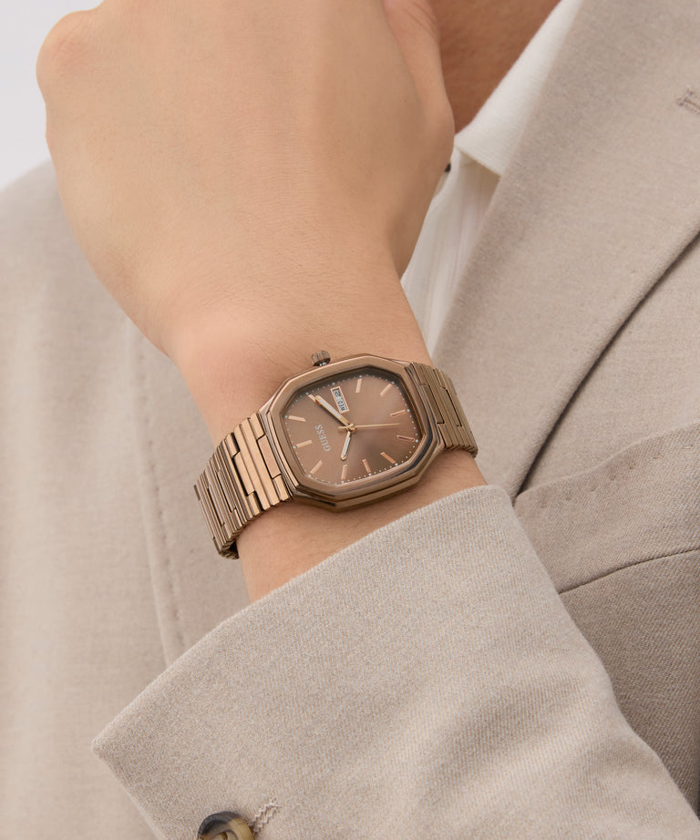 GUESS Mens Coffee Date Watch on a wrist with a neutral background