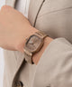 GUESS Mens Coffee Date Watch on a wrist with a neutral background