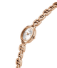 Rose gold watch with a white face on a white background lifestyle