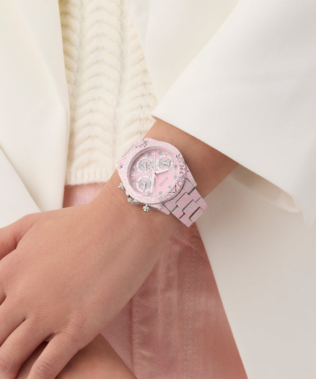 GUESS Ladies Pink Multi-function Watchon a wrist with a white background