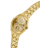 GUESS Ladies Gold Tone Multi-function Watch with diamond accents on a white background lifestyle