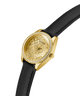 Gold GUESS Ladies Black Gold Tone Analog Watch with black strap on a white background lifestyle
