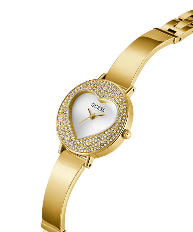 Gold watch with heart-shaped face and Guess logo on a white background lifestyle