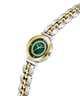 Two-tone GUESS Ladies 2-Tone Analog Watch with green dial and gold accents on a white background lifestyle
